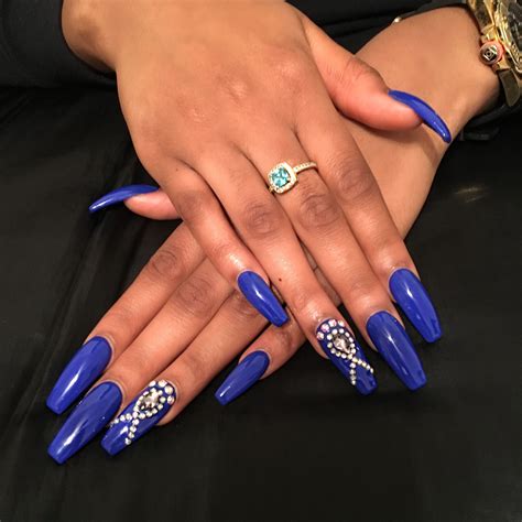 royal blue nails with rhinestones